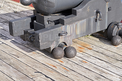 Buy stock photo Antique, cannon and deck of war ship closeup for Danish culture, heritage or transportation. Battle, engineering and vintage with weapon on wooden boat for maritime or nautical conflict at sea