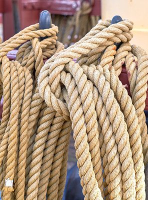 Buy stock photo Outdoor, ship and rope in pole at harbor for sailing, transportation and travel at deck. Ocean, marine and sailboat in closeup for luxury, adventure and trip or journey with cruise, cable or navigate