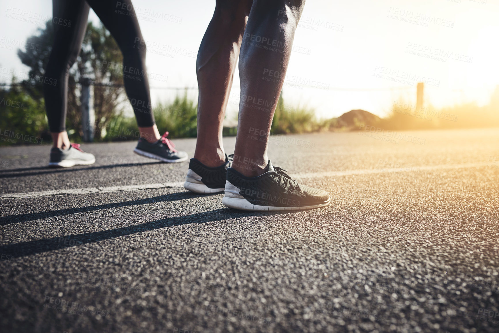 Buy stock photo Fitness, couple and legs with road for race, running or outdoor exercise on asphalt in sunshine. Active, man and woman with sneakers or shoes for sprint, marathon or challenge on street in nature