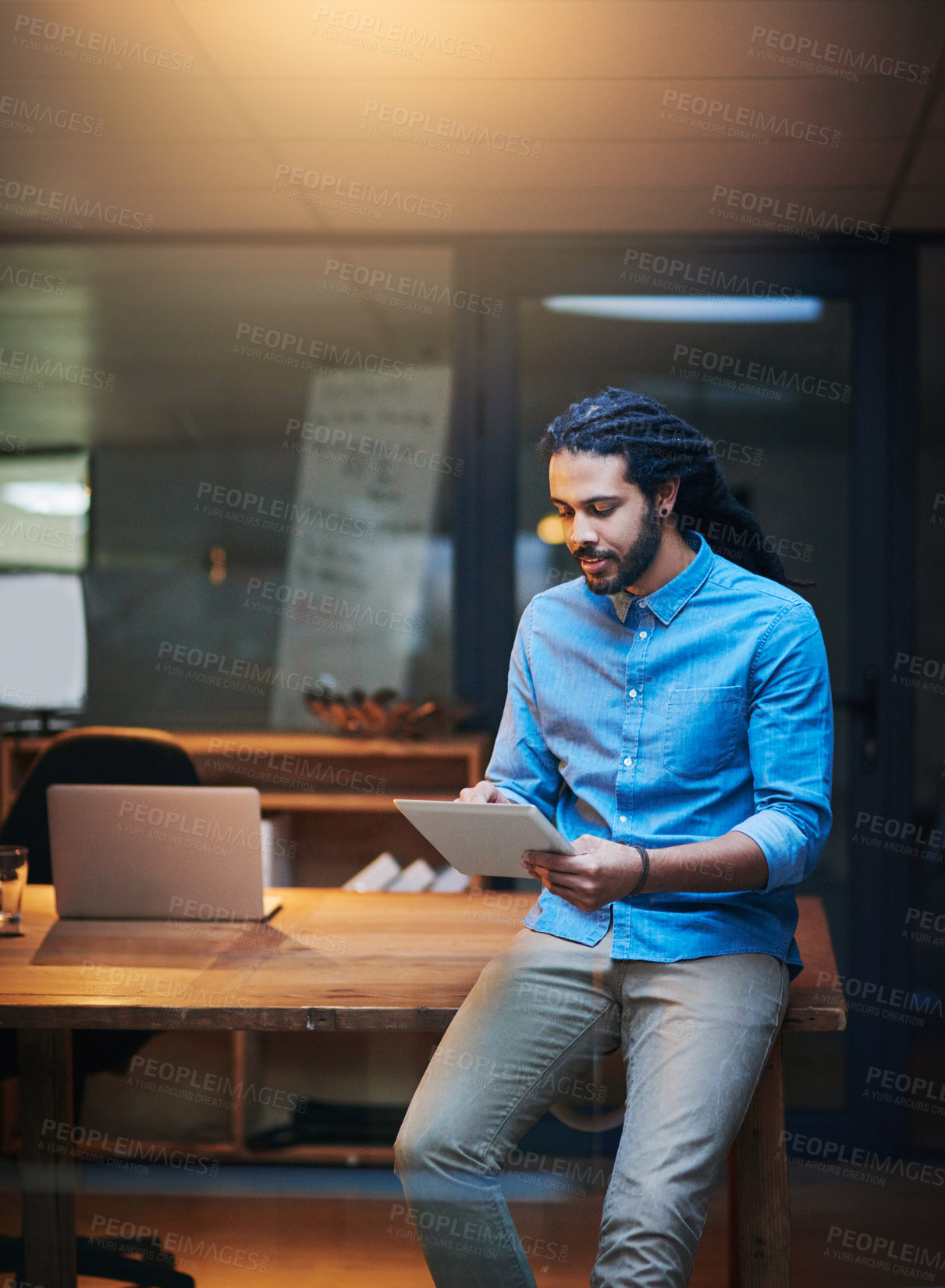 Buy stock photo Businessman, night and research with tablet for project, development or design at office. Young man, designer or employee working late on technology for online browsing, schedule planning or deadline