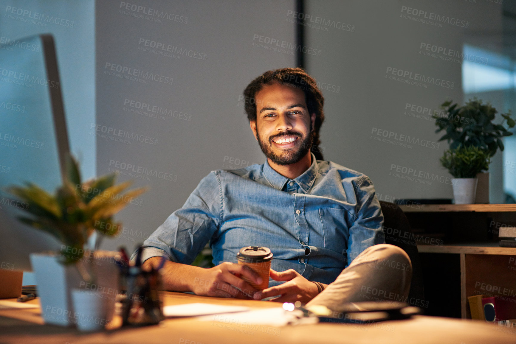 Buy stock photo Portrait of a young designer working late in an office