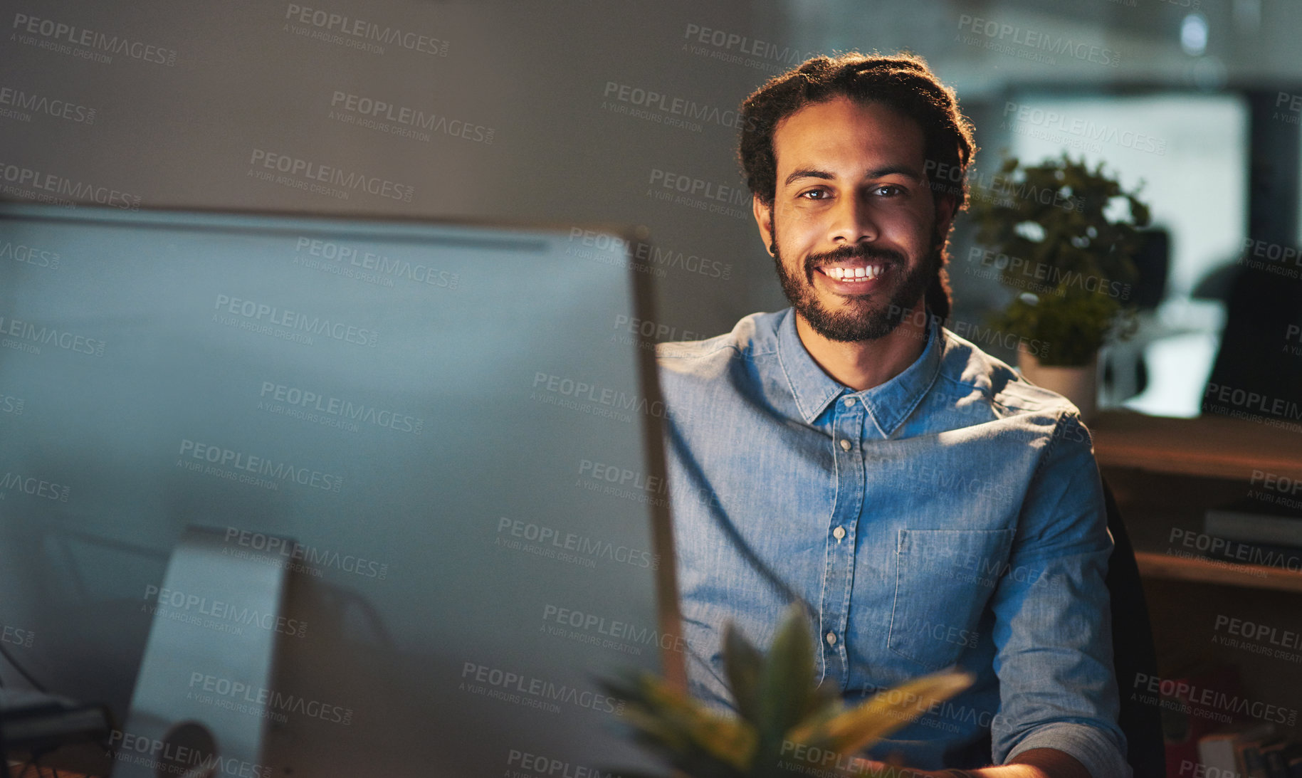 Buy stock photo Portrait of a young designer working late in an office