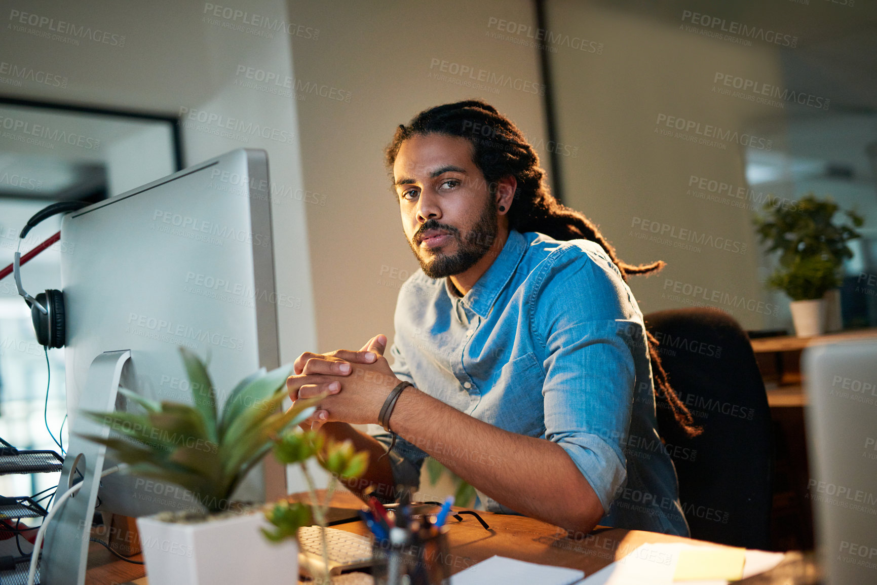 Buy stock photo Portrait of a young designer working late in an office