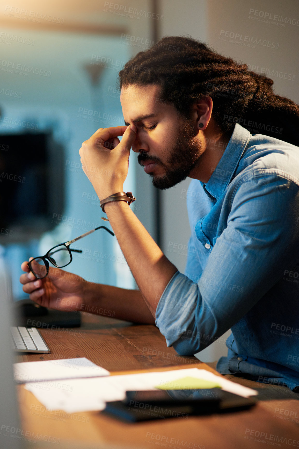 Buy stock photo Frustrated man, headache and night with stress for deadline, pressure or bankruptcy at office. Businessman, employee or designer working late with pain, strain or anxiety for debt or financial crisis