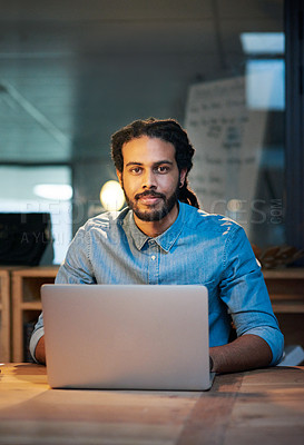 Buy stock photo Portrait of a young designer working late in an office