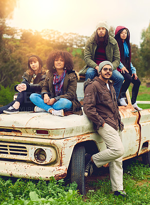 Buy stock photo Portrait of a group of friends posed around an old truck in a field