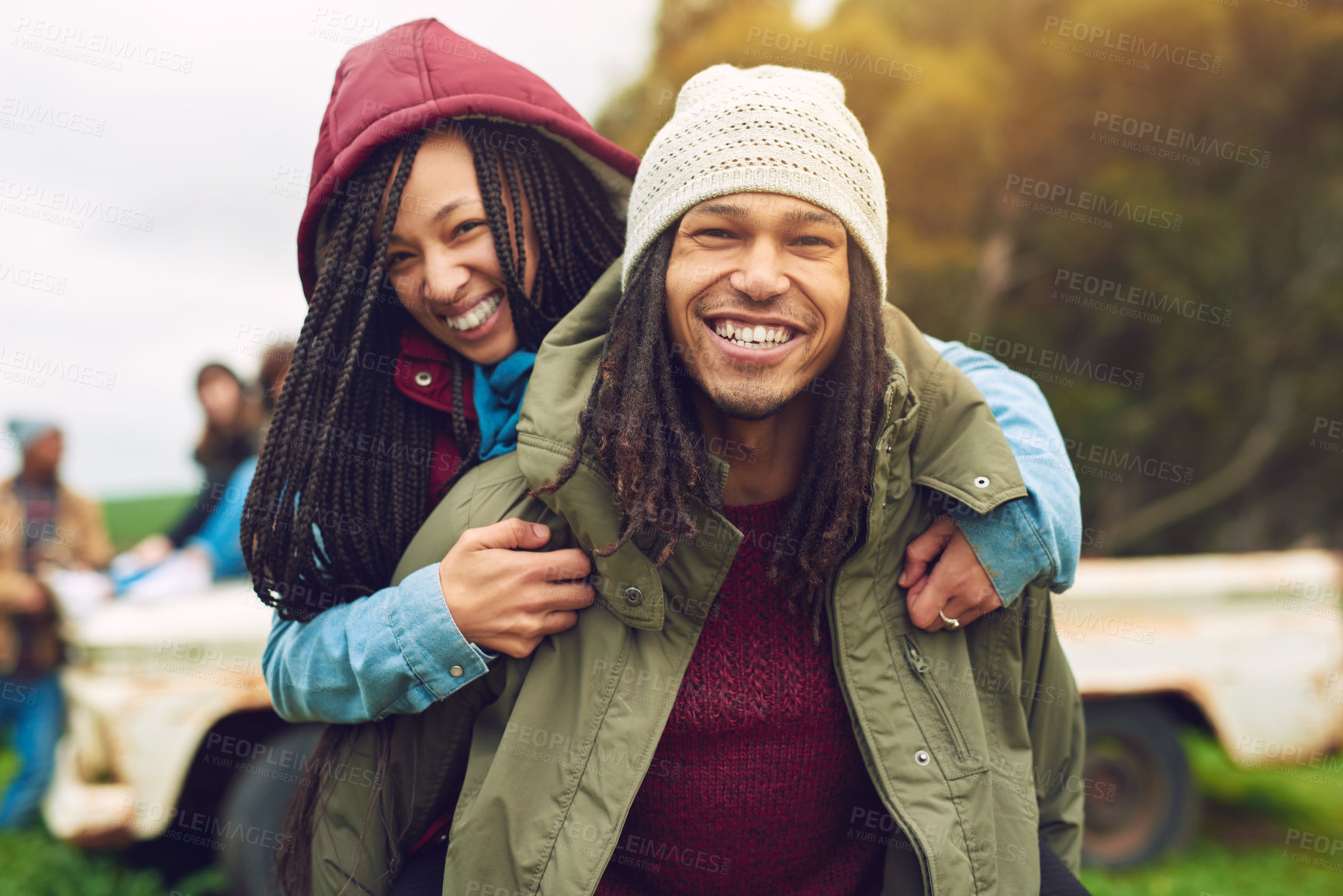 Buy stock photo Smile, african couple portrait and piggyback in park, bonding and fun on holiday with winter date. Happy, man and woman with vacation for love, care and freedom in nature, forest or woods travel