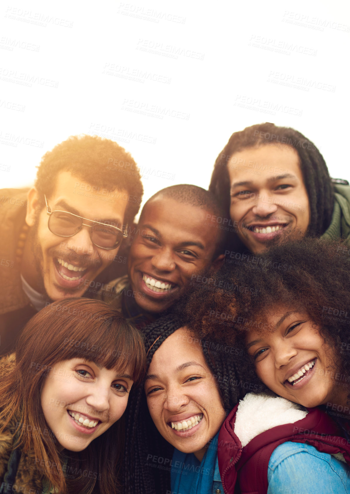Buy stock photo Portrait of a happy group of friends posing together outside