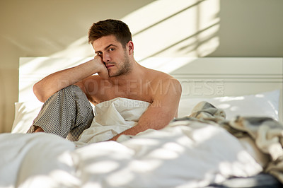 Buy stock photo Portrait, depression and man in bedroom with stress, fatigue and wake up in home in Germany. Face, serious and tired person in bed with insomnia, sad and mental health crisis in the morning in house