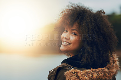 Buy stock photo Portrait of a beautiful young woman relaxing by a lake