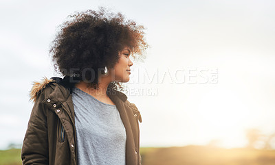 Buy stock photo Shot of a beautiful young woman admiring a view in nature