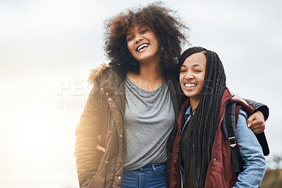 Buy stock photo Portrait of two happy friends posing together outside