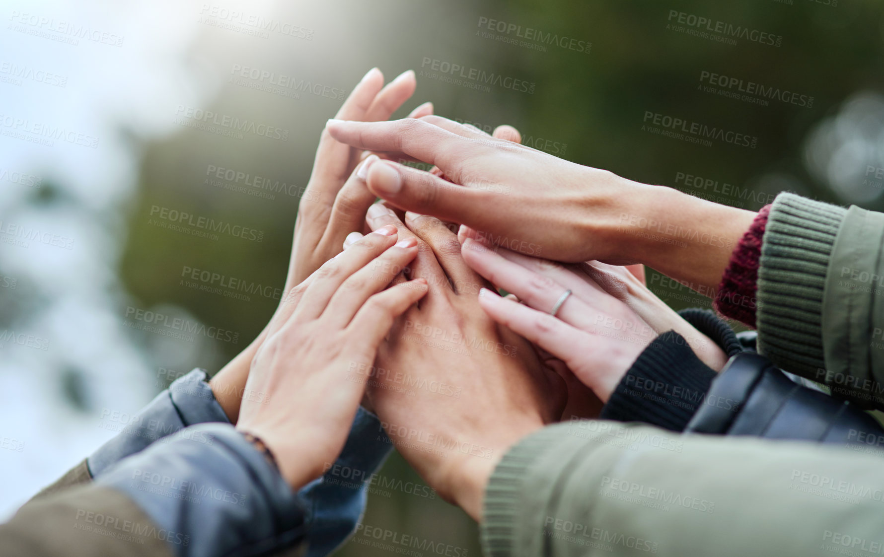 Buy stock photo Closeup shot of a group of friends with their hands together in unity