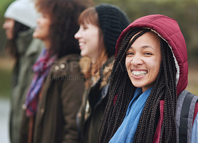 Buy stock photo Portrait of a group of happy friends posing together outside