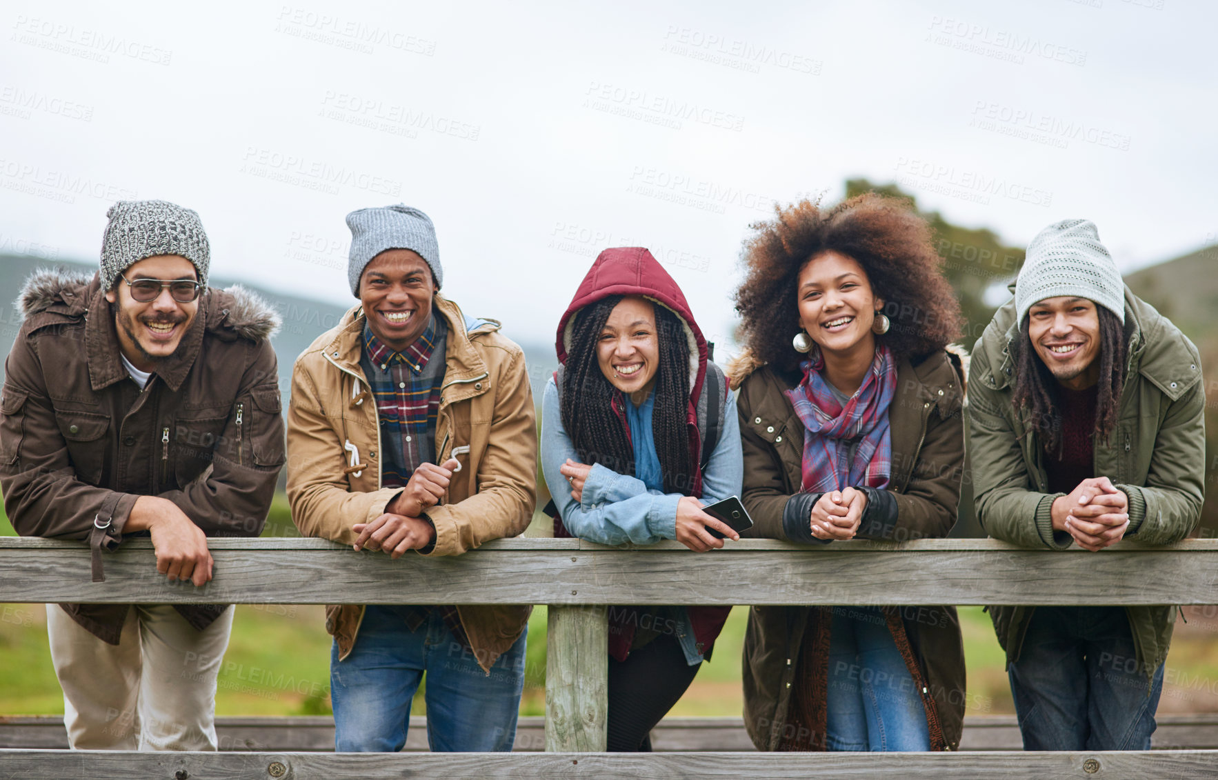 Buy stock photo Happy people, portrait and wooden bridge with friends for camping, adventure or travel together in nature. Young, group or smile with friendship for weekend, holiday or outdoor hike in countryside