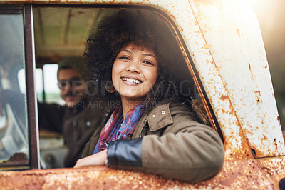 Buy stock photo Portrait of a happy young woman sitting in a rusty old truck