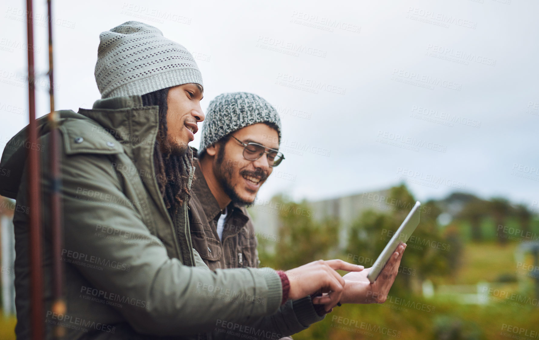 Buy stock photo Happy men, camping and research with tablet on patio in nature for connectivity, signal or online streaming. Male people, relax or campers with technology for entertainment or app at holiday house