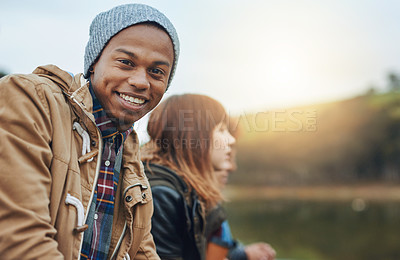 Buy stock photo Shot of a young man spending time outdoors on a weekend getaway