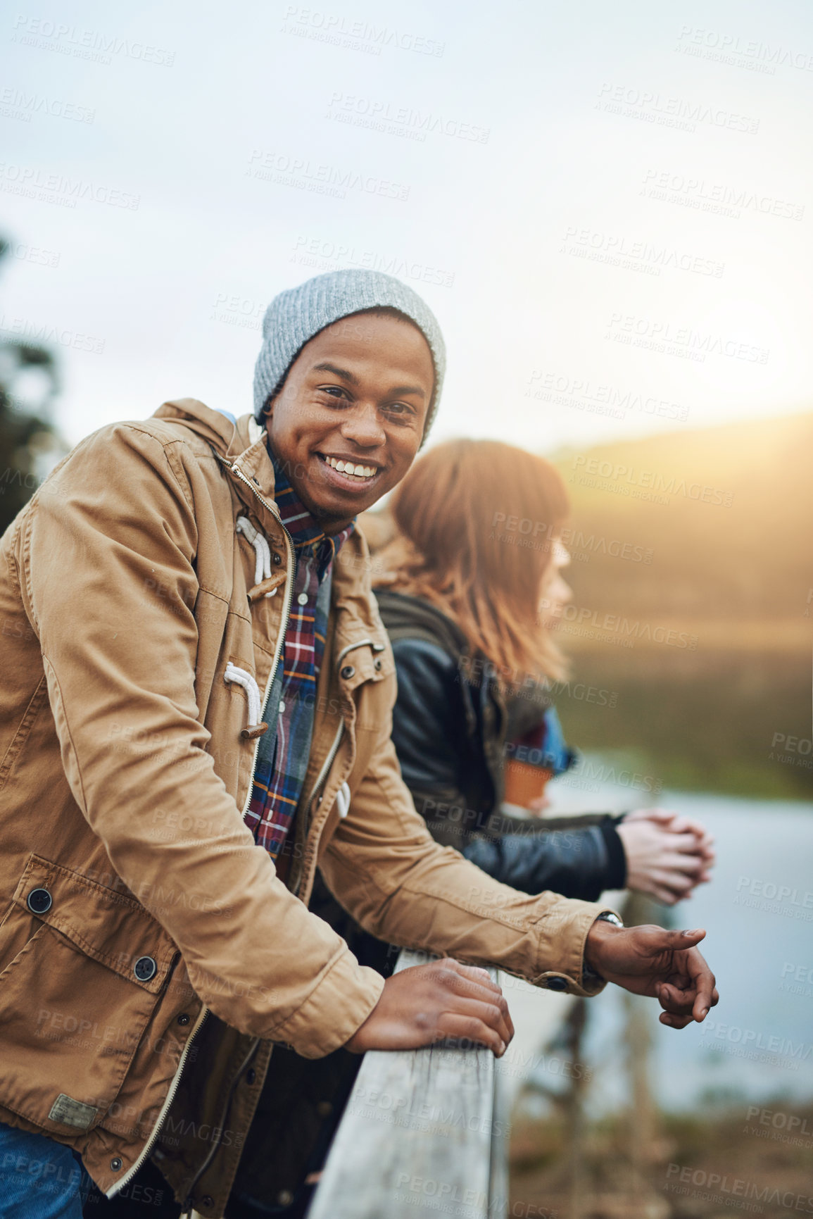 Buy stock photo Winter, friends and portrait of man in nature with smile, fun bonding and outdoor adventure together. Lake, happy face and group of people on pier for vacation, travel and relax on countryside bridge