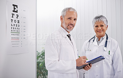 Buy stock photo Team of doctors with clipboard, smile and optometrist with medical paperwork, collaboration and health insurance. Senior man, woman in portrait at optometry practice with information and checklist