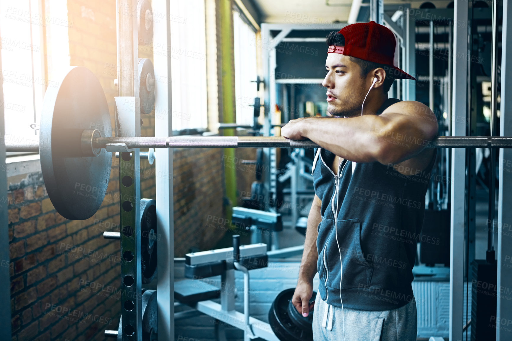 Buy stock photo Shot of a man doing weight training at the gym