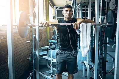 Buy stock photo Shot of a man doing weight training at the gym