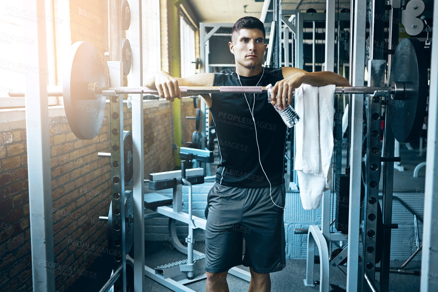 Buy stock photo Shot of a man doing weight training at the gym