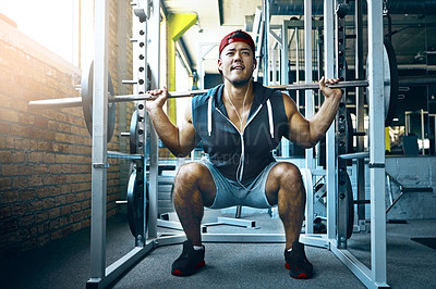 Buy stock photo Shot of a man doing weight training at the gym