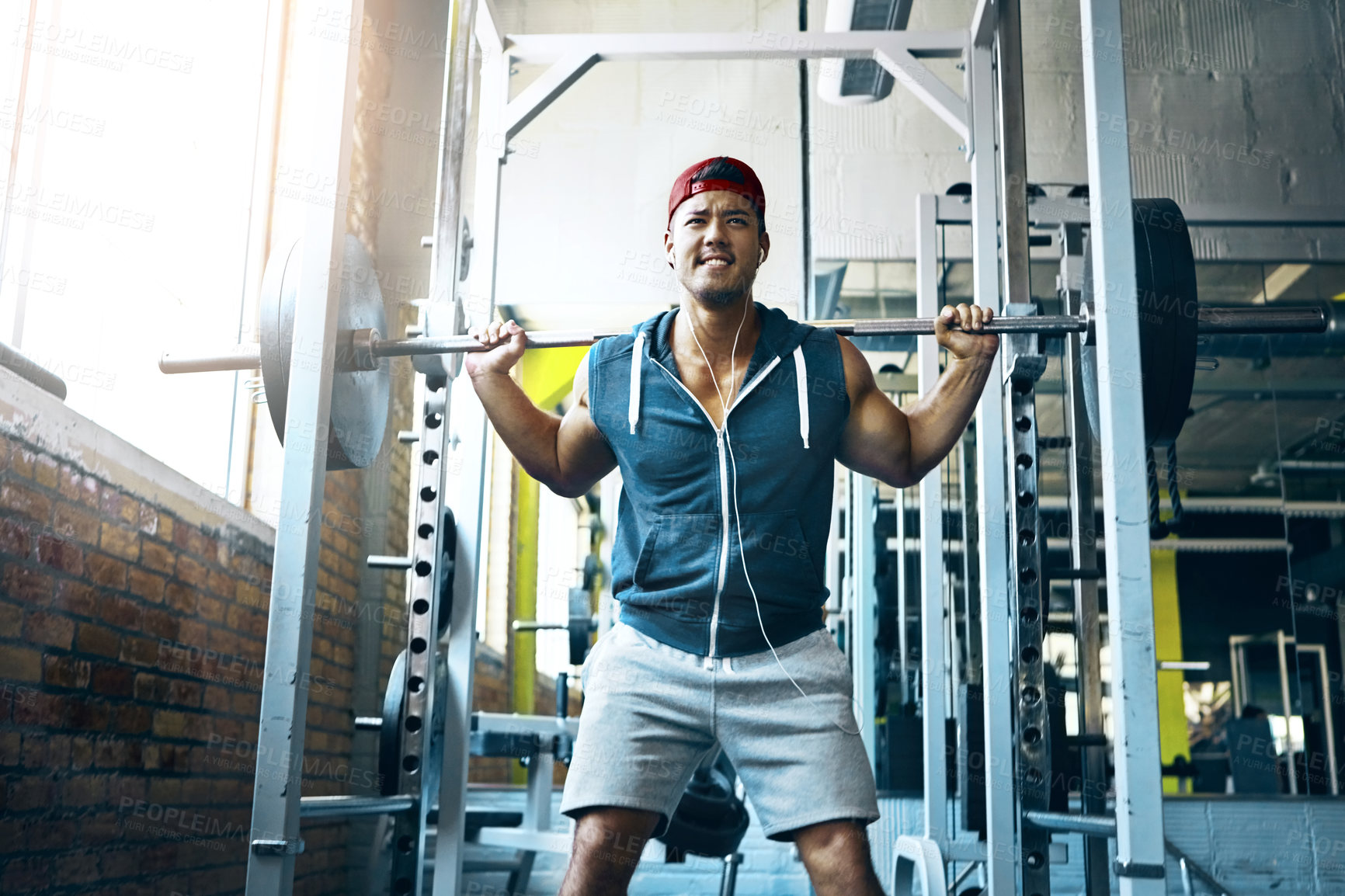 Buy stock photo Shot of a man doing weight training at the gym