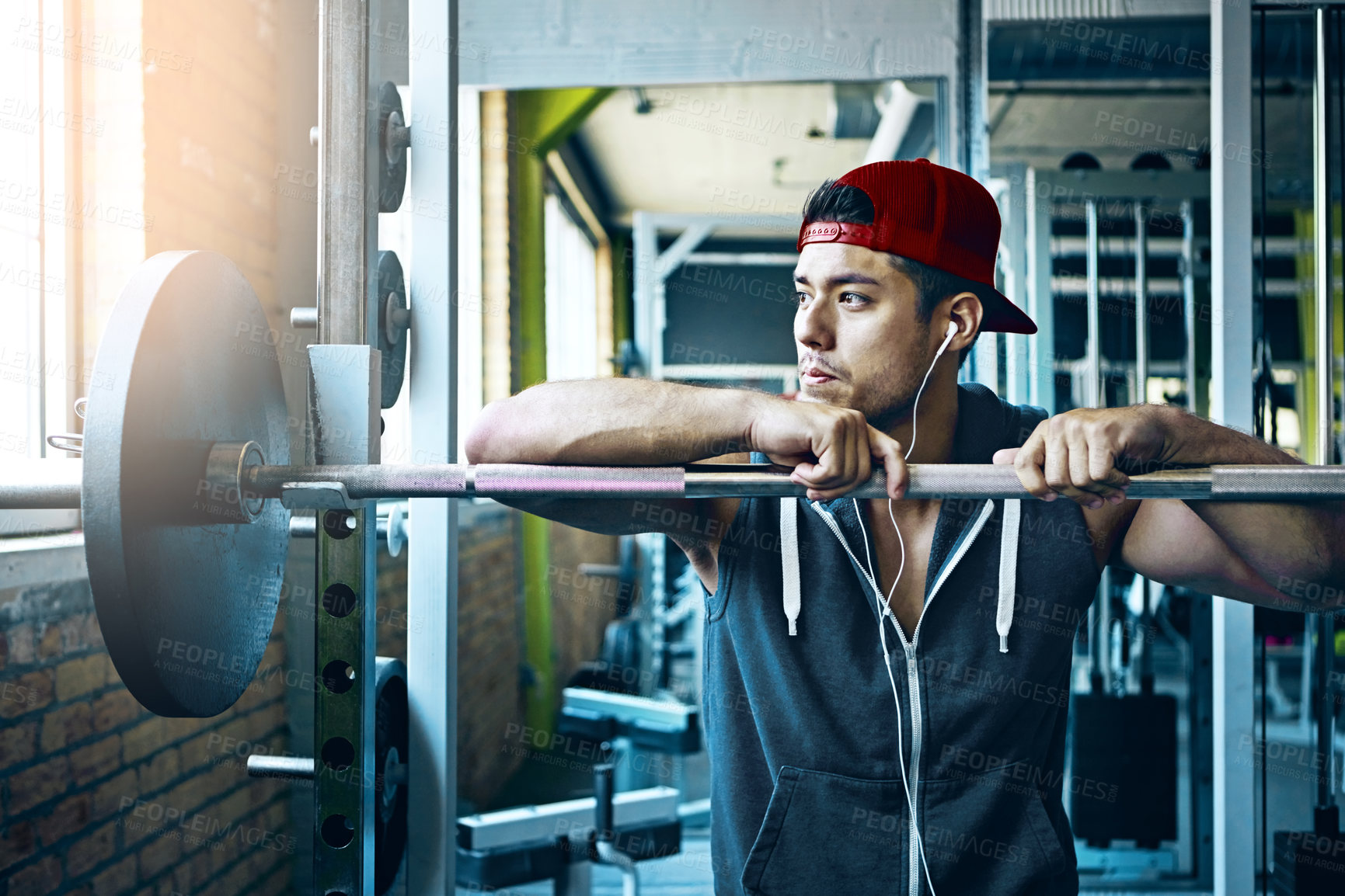 Buy stock photo Shot of a man doing weight training at the gym