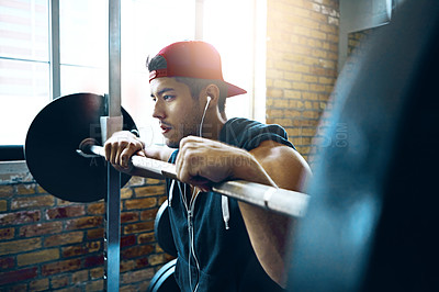 Buy stock photo Shot of a man doing weight training at the gym