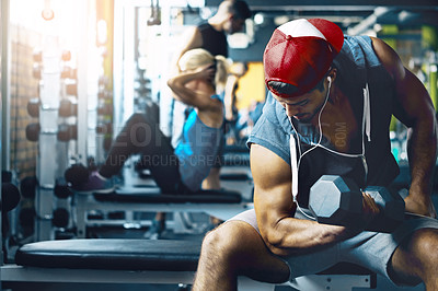 Buy stock photo Shot of a man doing weight training at the gym