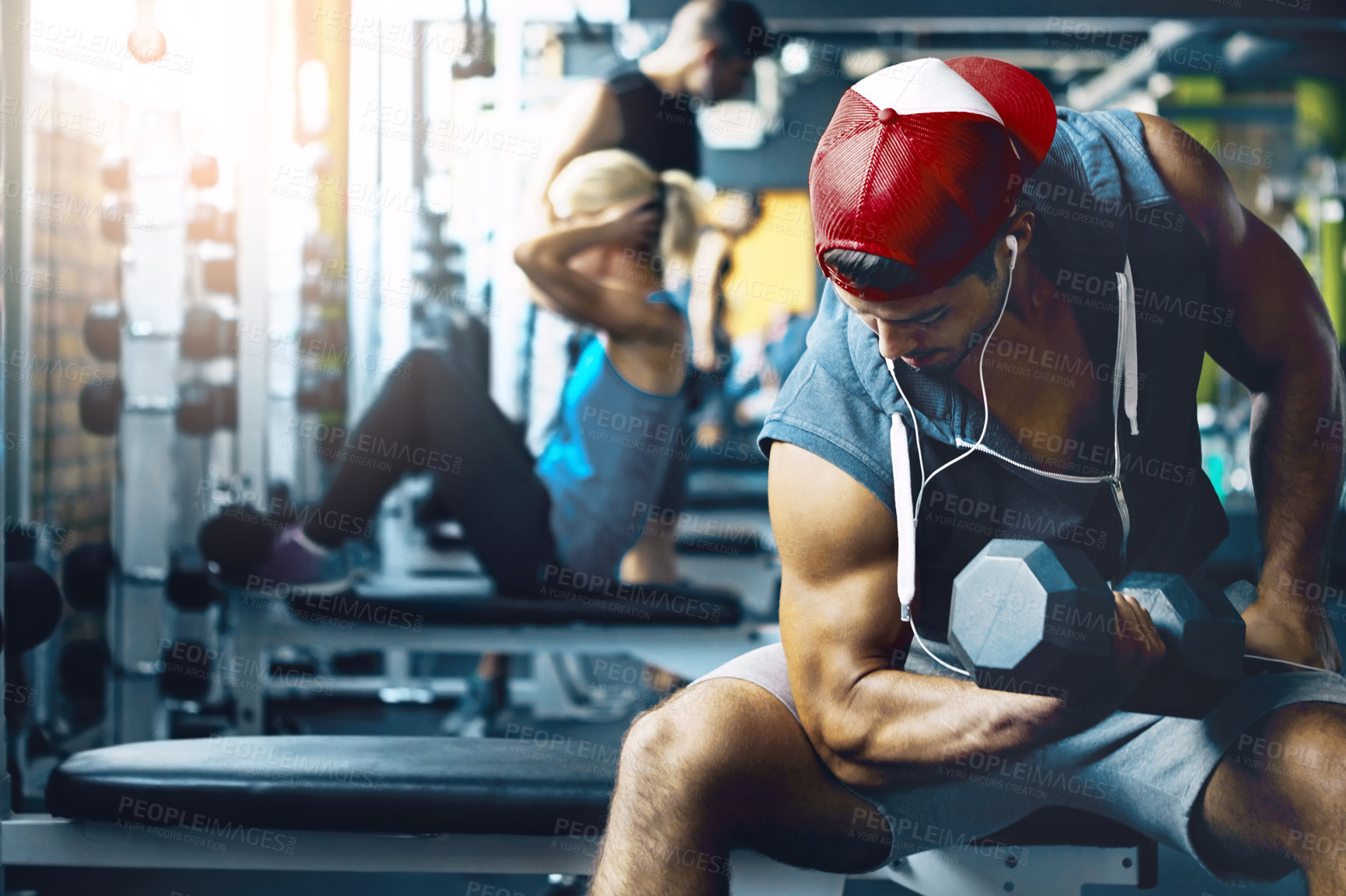 Buy stock photo Shot of a man doing weight training at the gym