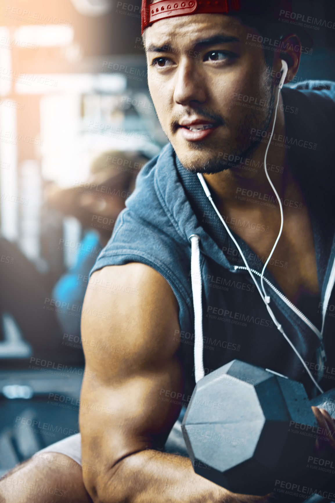 Buy stock photo Shot of a man doing weight training at the gym