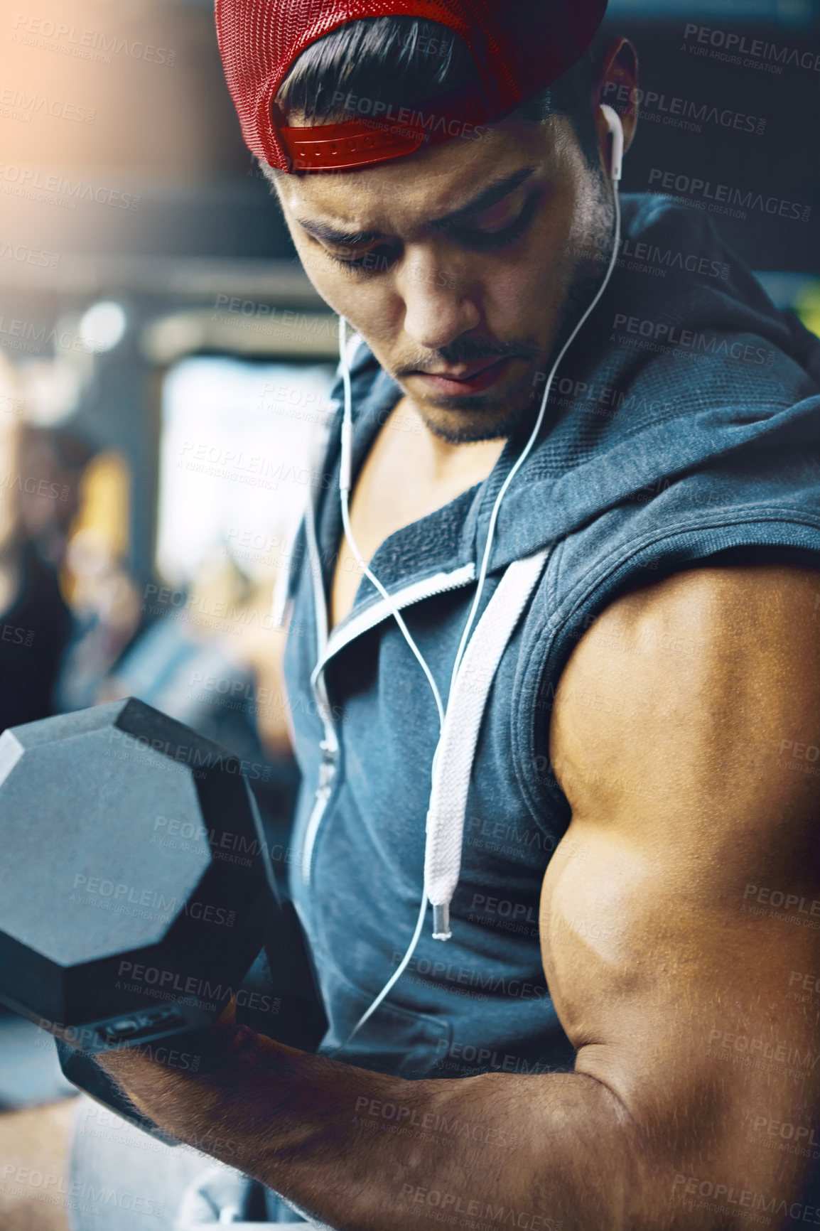 Buy stock photo Shot of a man doing weight training at the gym