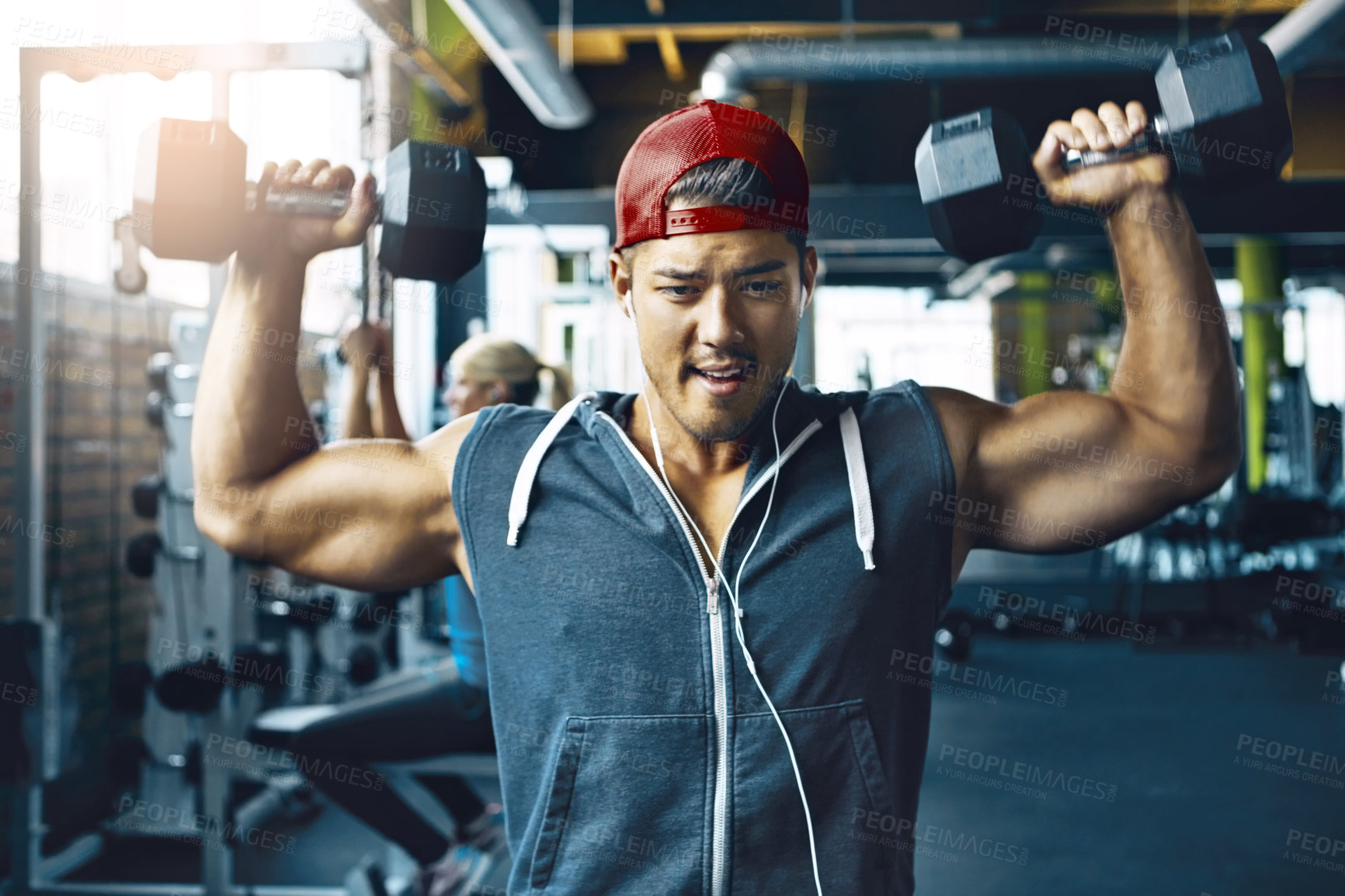 Buy stock photo Shot of a man doing weight training at the gym