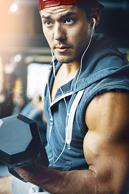 Buy stock photo Shot of a man doing weight training at the gym