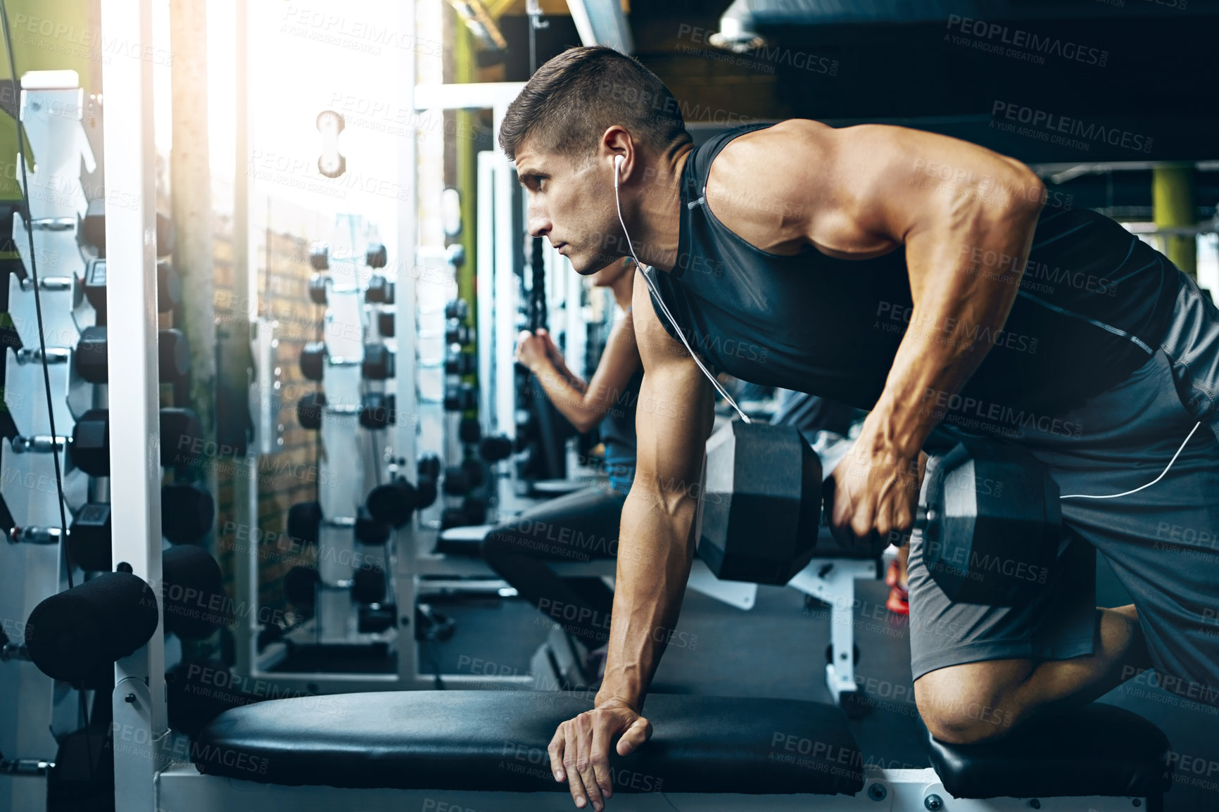 Buy stock photo Shot of a man doing weight training at the gym