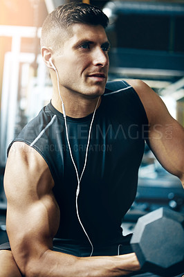 Buy stock photo Shot of a man doing weight training at the gym