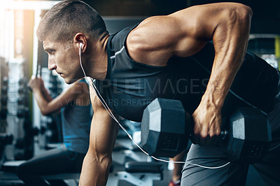 Buy stock photo Shot of a man doing weight training at the gym