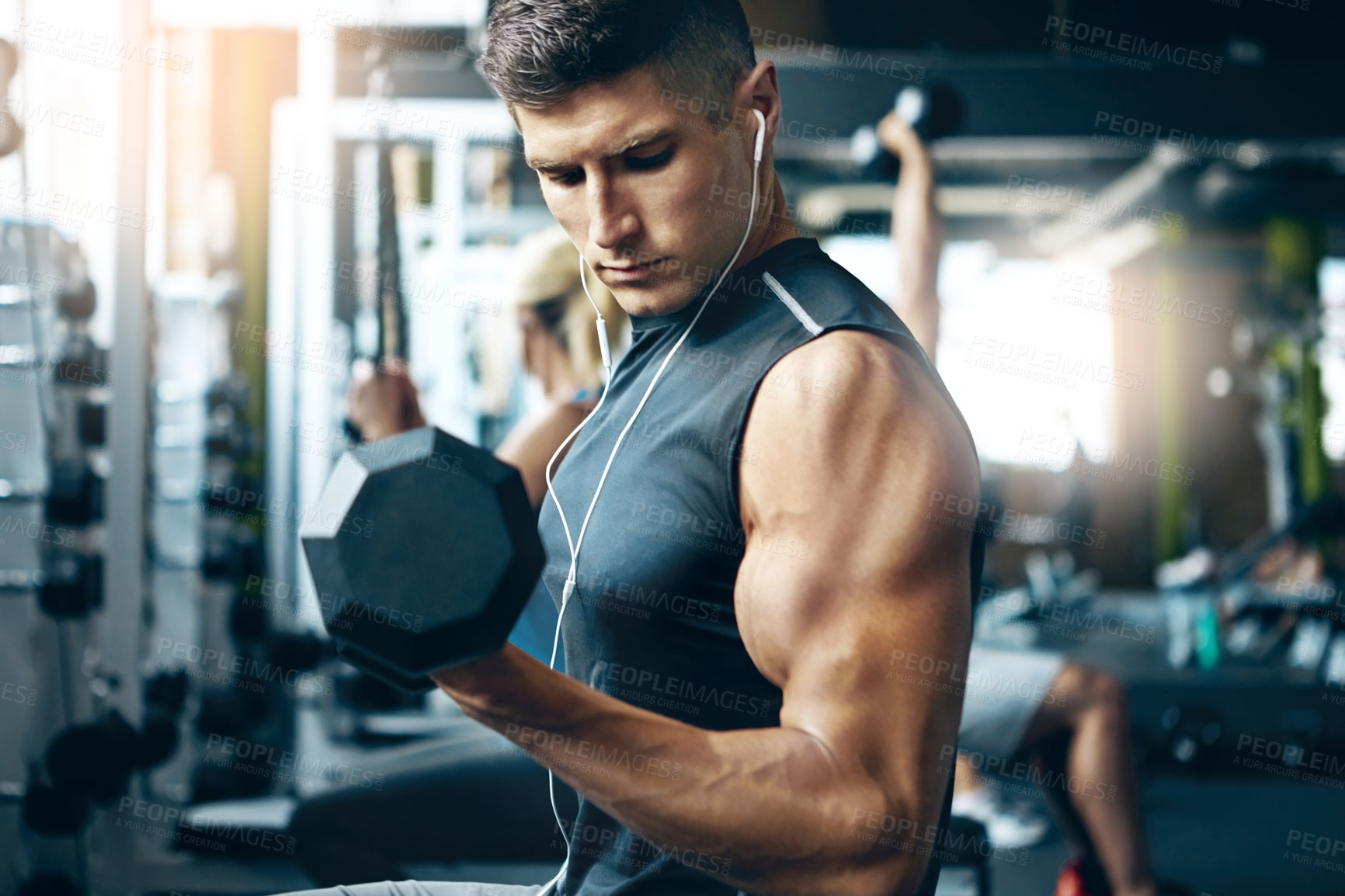 Buy stock photo Shot of a man doing weight training at the gym