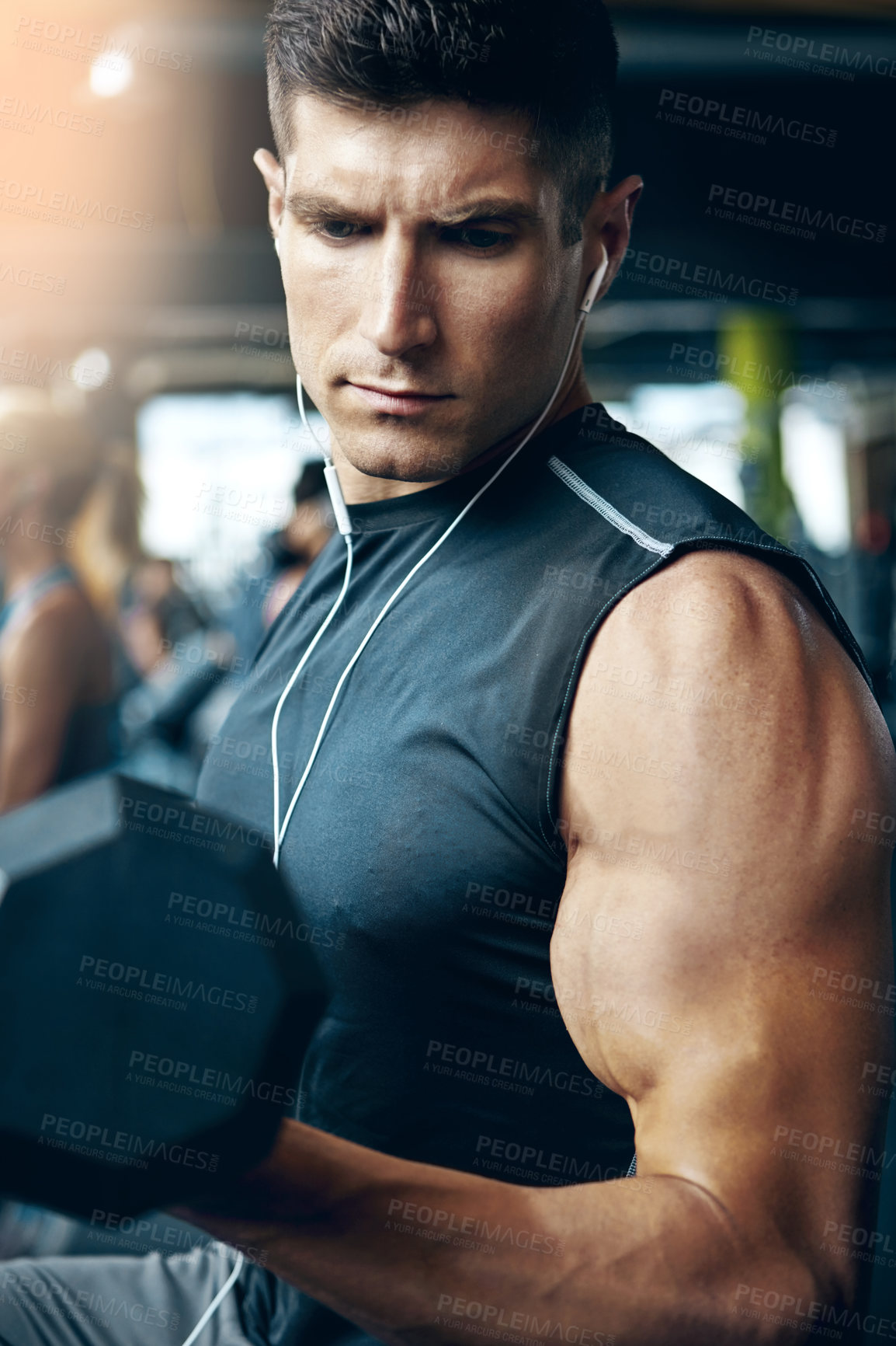 Buy stock photo Shot of a man doing weight training at the gym