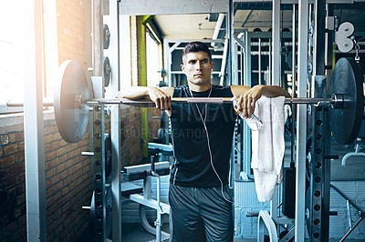 Buy stock photo Shot of a man doing weight training at the gym