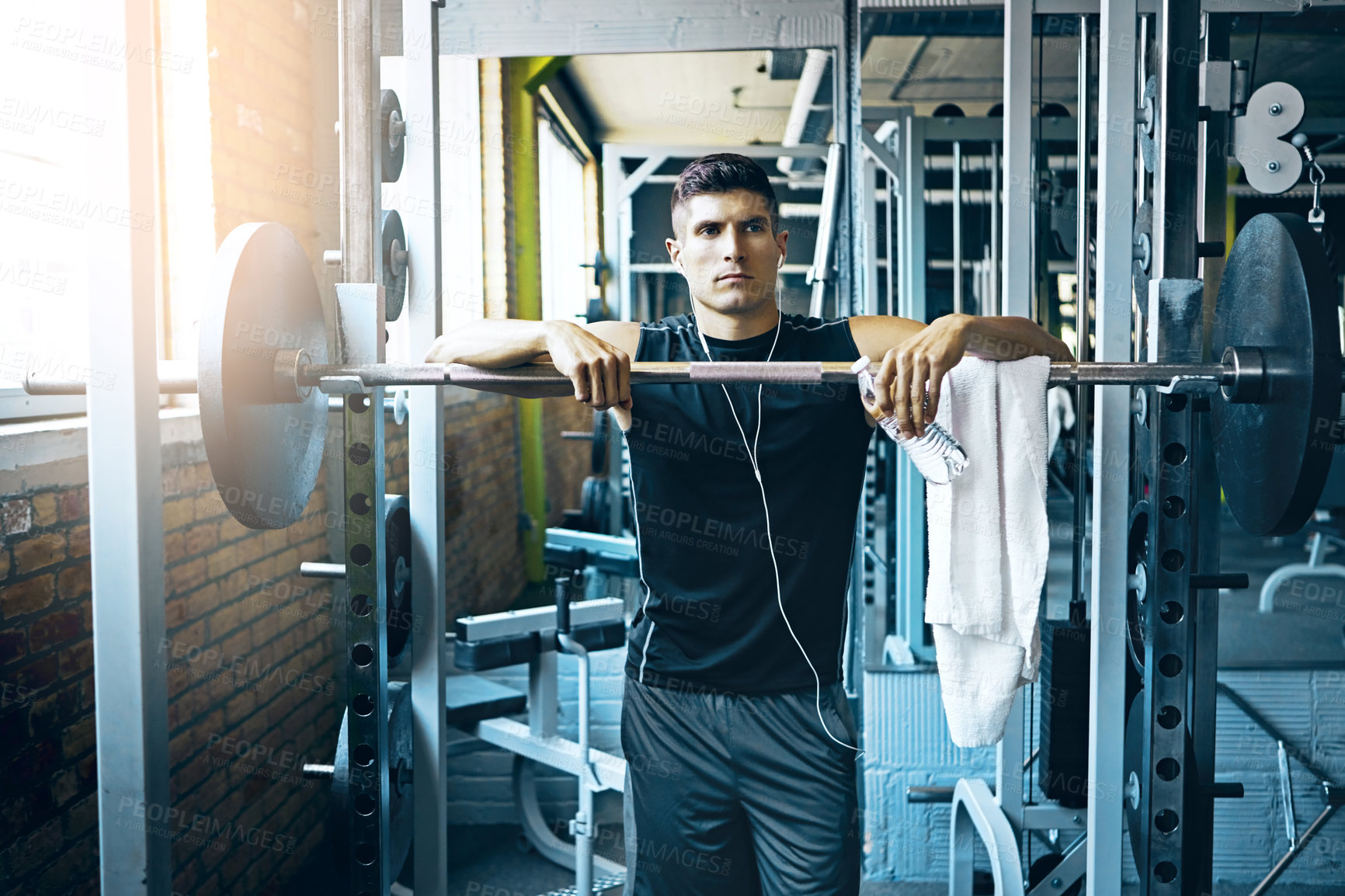 Buy stock photo Shot of a man doing weight training at the gym