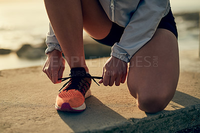 Buy stock photo Shot of a young sporty woman running outside