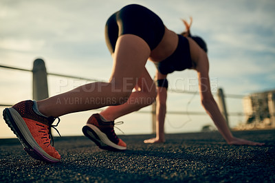 Buy stock photo Shot of a young sporty woman on her marks