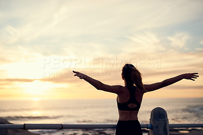Buy stock photo Shot of a young sporty woman running outside