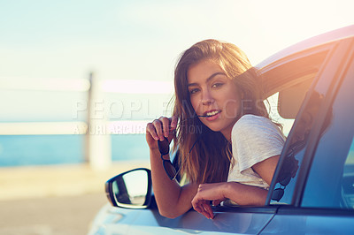 Buy stock photo Portrait of a young woman leaning out the window of her car