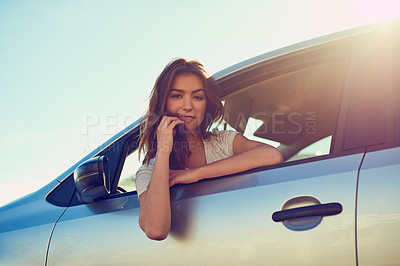 Buy stock photo Portrait of a young woman sitting in her car