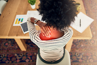 Buy stock photo High angle shot of a young woman experiencing neck pain while working from home